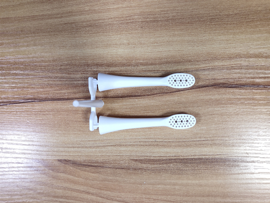 Biens EN TANT QUE composants en plastique de moulage par injection pour traiter la brosse à dents